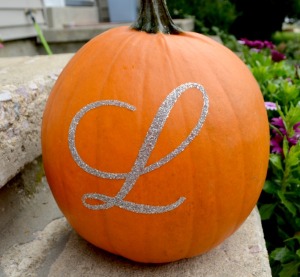 With basic stencils you can create a custom monogram for your pumpkin. Simply outline with craft glue and sprinkle with loose glitter - Or fill in your stencil with paint for a different look. 